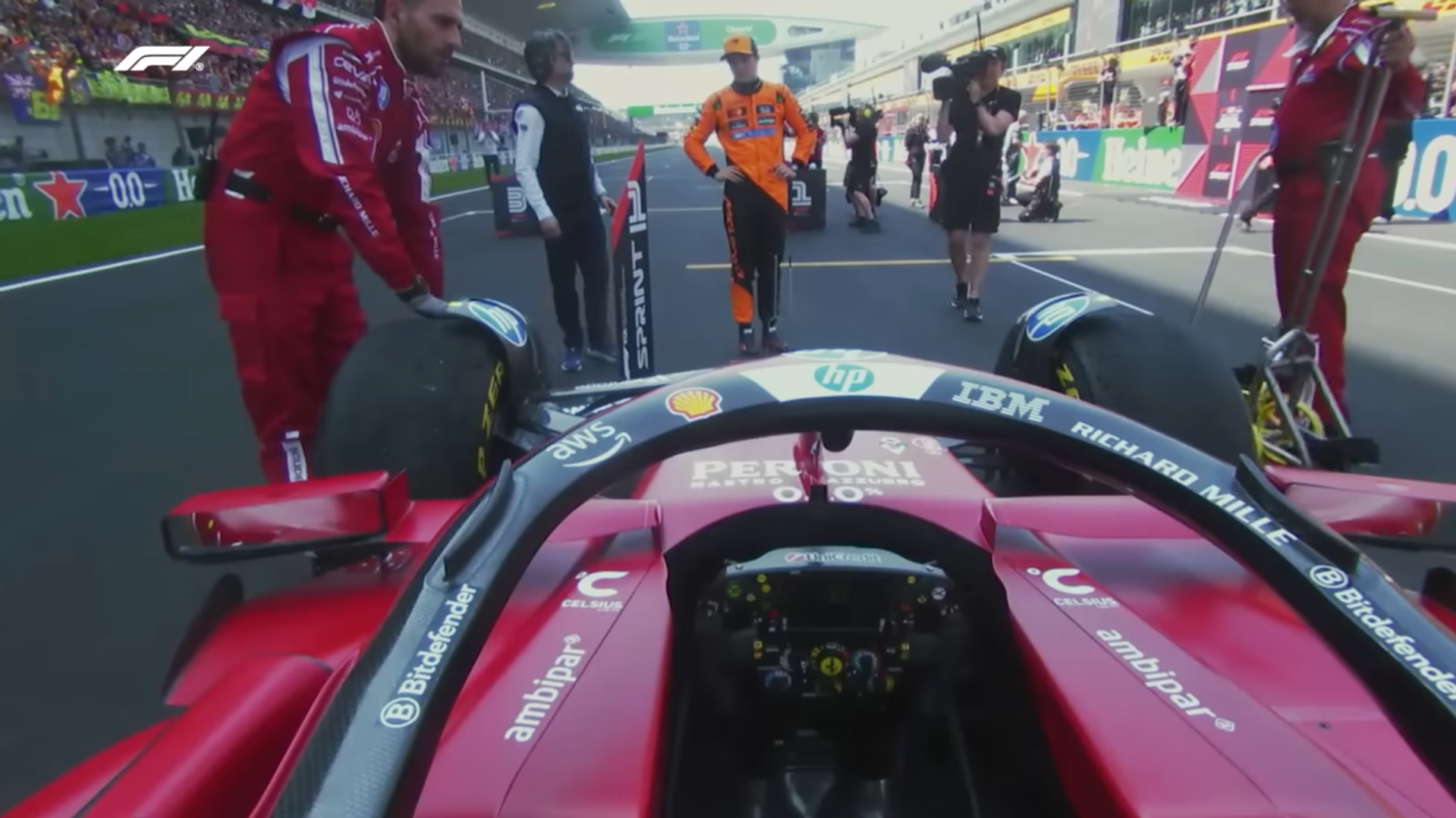 Oscar Piastri checking out Ferrari's car